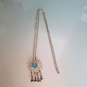 Necklace with dangle pieces